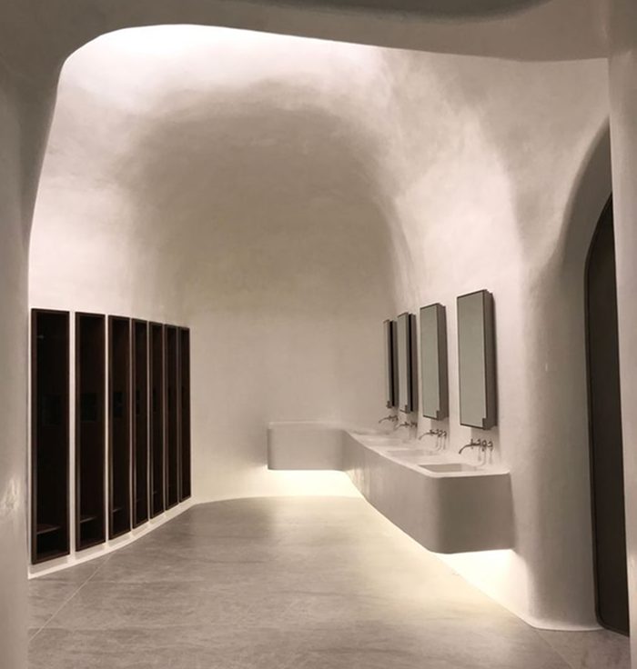 Sculptural curved plaster interior lit from above